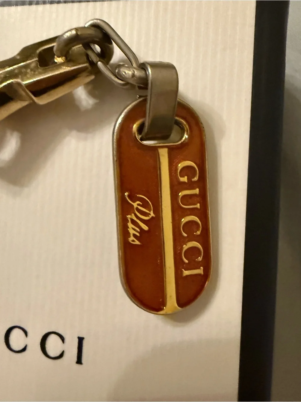 Gucci Plus mixed metal and red enamel keychain